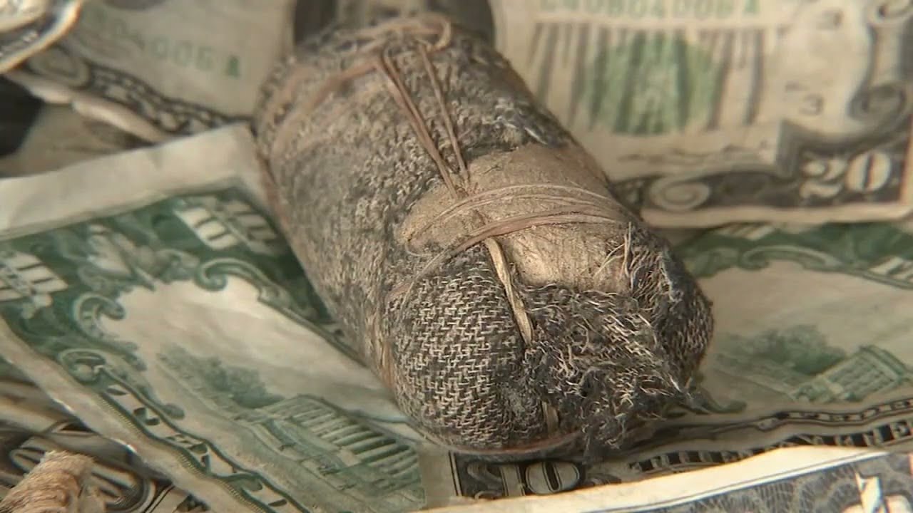 LOST MONEY: Couple unearths cash dating back to Great Depression from their front yard